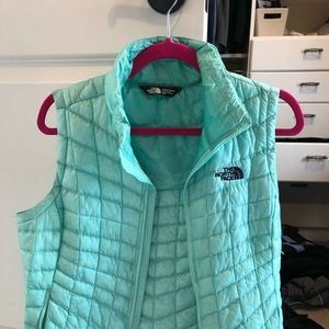 North face mint green vest.